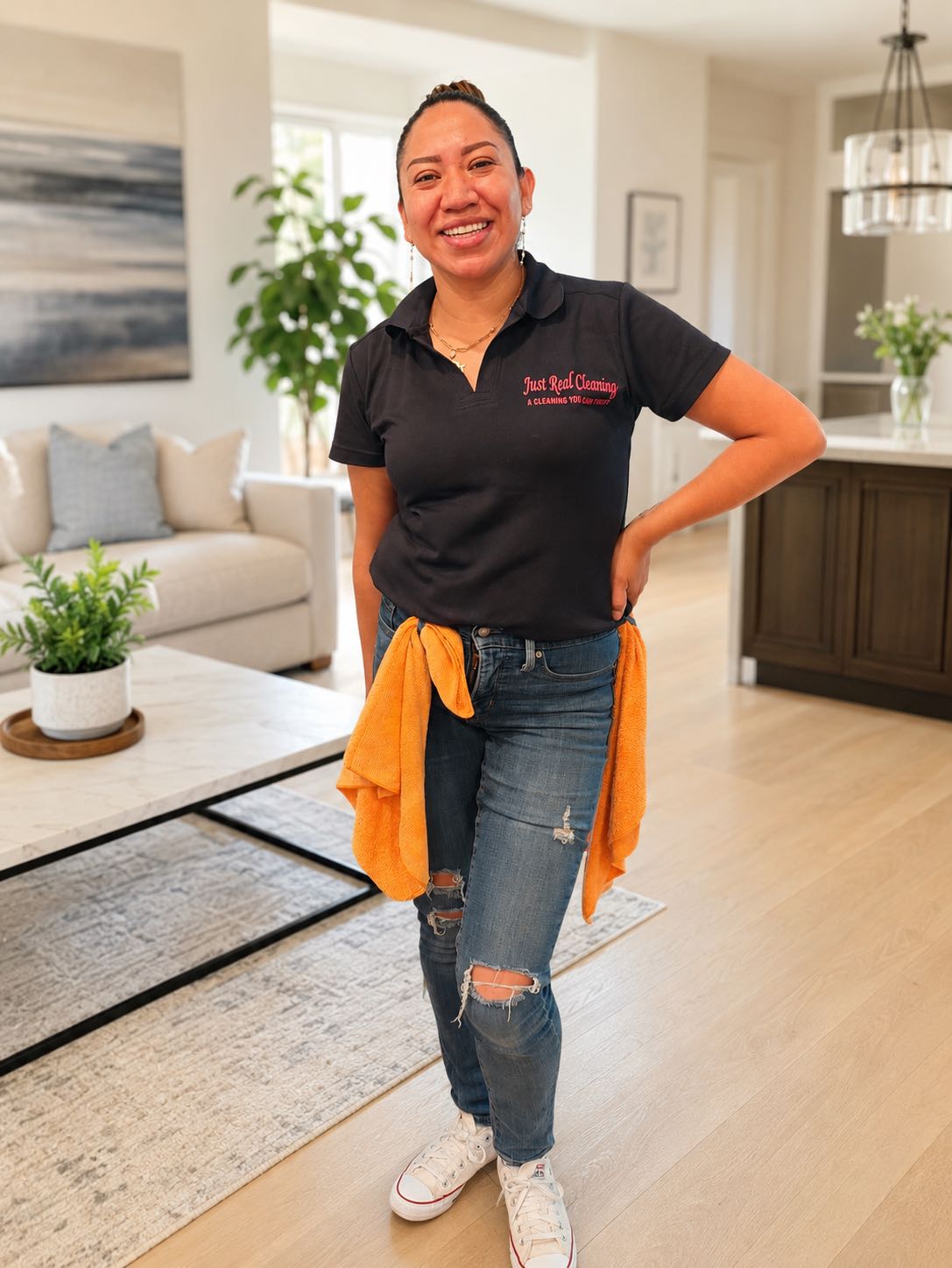 Veronica Acevedo, owner of Just Real Cleaning, smiling in a home.